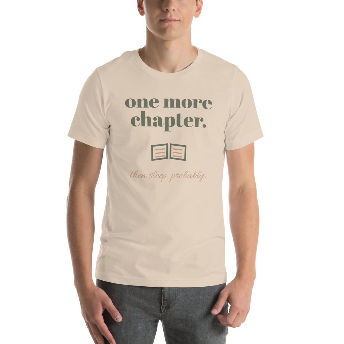 One More Chapter Tee in Soft Cream, worn by a model, front print: one more chapter, an open book, then sleep, probably