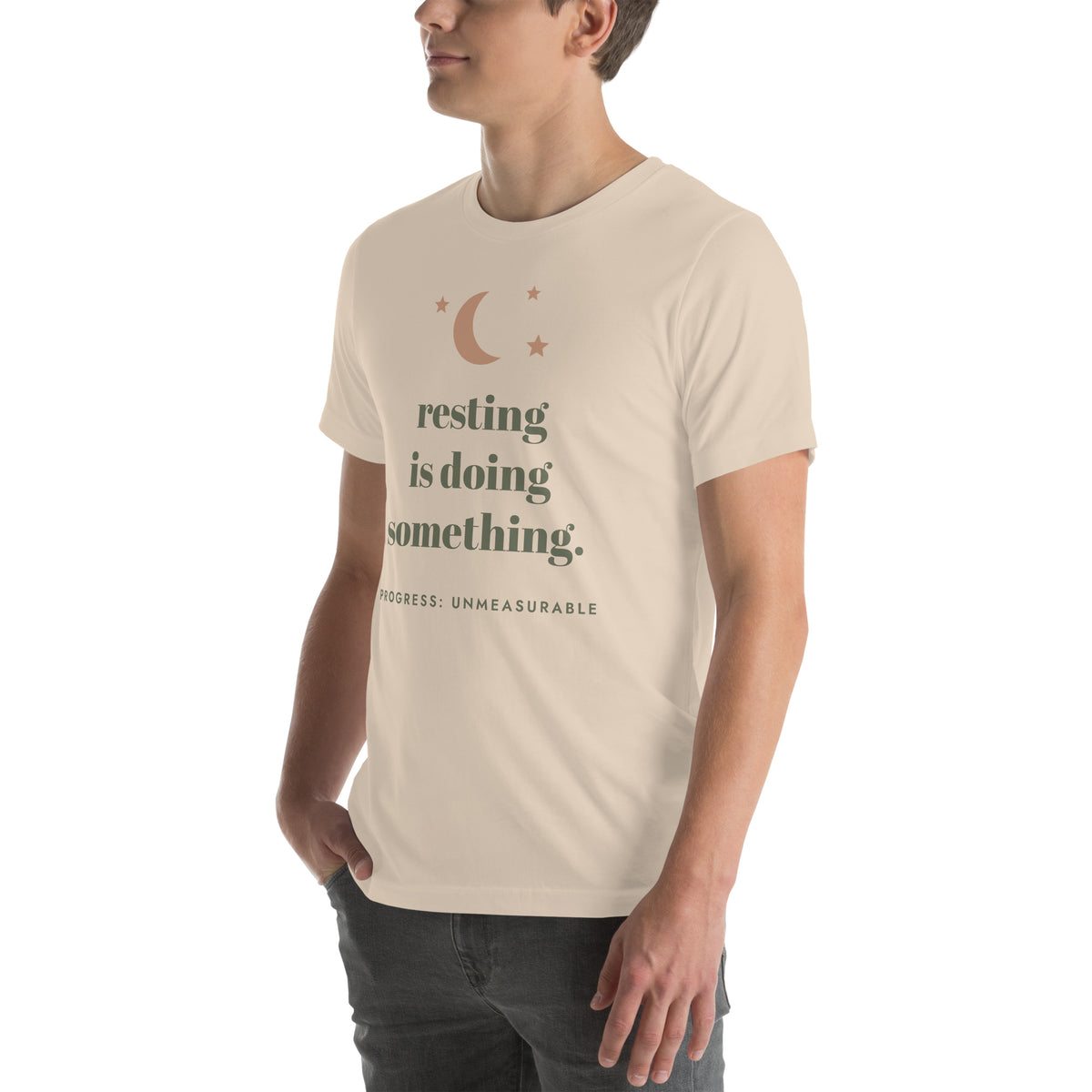 Resting Is Doing Something Tee in Soft Cream, worn by a model, three-quarter view from the left